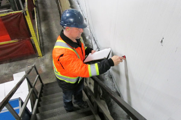 estimator testing paint and preparing a cost / price quote for wall painting estimator testing paint and preparing a cost / price quote for wall painting