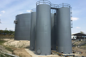 repainted industrial liquid storage tanks/silos, St. Catharines ON