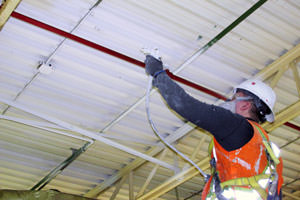 spray painting of stained metal ceiling in Burlington, Ontario