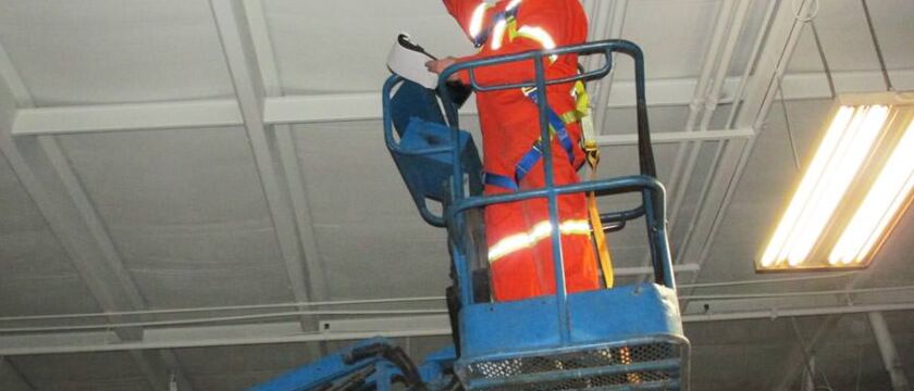 estimator preparing a cost / price quote for ceiling painting