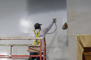 spray painting of a wall by an industrial painter in Cambridge, Ontario