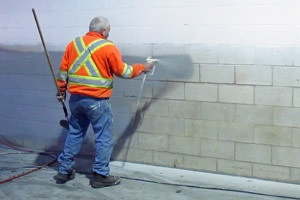 painting of a cinder block wall by an Ingersoll commercial painter